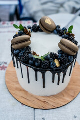 Wedding cake with fruits and macarons