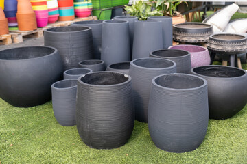 A lot of black colored porcelain flower pots