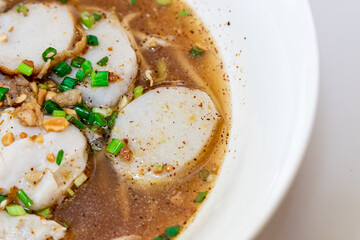 Spicy Thai style noodle on white table