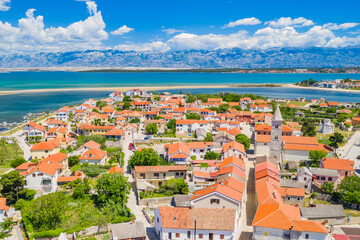 Fototapeta na wymiar Old town on Nin on Adriatic coast in Croatia, seascape and Velebit mountain in background, panoramic view