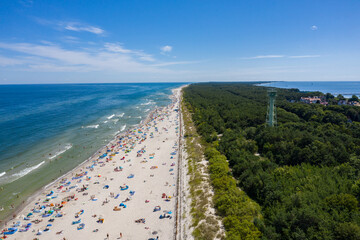 Sunbathing on the beach by the sea. Aerial drone view of  Baltic Sea coast in Hel peninsula,...