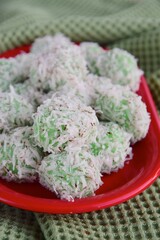Indonesian Cuisine, Klepon or Traditional Pandanus Rice Balls Made From Glutinous Flour and Grated Coconut with Palm sugar Filling
