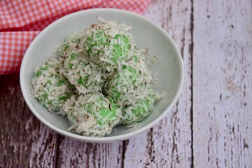 Indonesian Cuisine, Klepon or Traditional Pandanus Rice Balls Made From Glutinous Flour and Grated Coconut with Palm sugar Filling