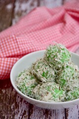 Indonesian Cuisine, Klepon or Traditional Pandanus Rice Balls Made From Glutinous Flour and Grated Coconut with Palm sugar Filling