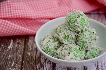 Indonesian Cuisine, Klepon or Traditional Pandanus Rice Balls Made From Glutinous Flour and Grated Coconut with Palm sugar Filling