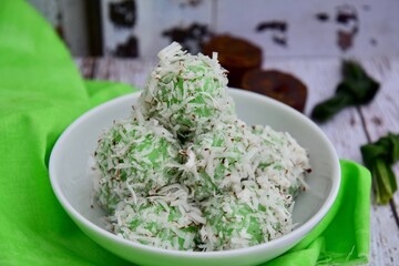 Indonesian Cuisine, Klepon or Traditional Pandanus Rice Balls Made From Glutinous Flour and Grated Coconut with Palm sugar Filling