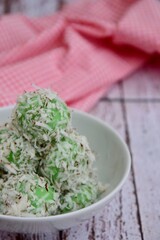 Indonesian Cuisine, Klepon or Traditional Pandanus Rice Balls Made From Glutinous Flour and Grated Coconut with Palm sugar Filling