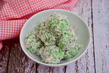 Indonesian Cuisine, Klepon or Traditional Pandanus Rice Balls Made From Glutinous Flour and Grated Coconut with Palm sugar Filling