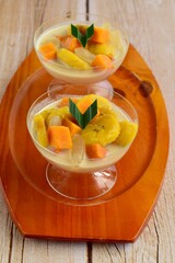 Indonesian Food - Kolak Pisang Ubi Kolang Kaling (Banana, sweet potato and palm seed). Cooked with coconut milk, palm sugar and pandanus leaves.