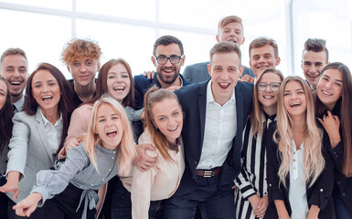 team of cheerful young people looking at the camera