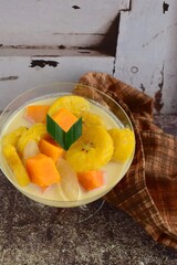 Indonesian Food - Kolak Pisang Ubi Kolang Kaling (Banana, sweet potato and palm seed). Cooked with coconut milk, palm sugar and pandanus leaves.