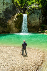photographer sati ozdemir takes photos at the waterfall.