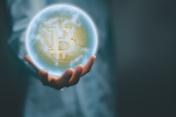 Business hand holding global bitcoin. Financial technology, Blockchain and fintech Investment,...
