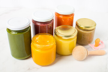 Variety of homemade baby vegetable and fruit puree