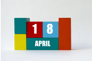 Day of month. Cube Calendar on multi-colored cubes on white background