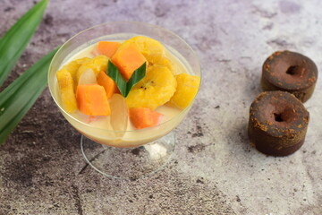 Indonesian Food - Kolak Pisang Ubi Kolang Kaling (Banana, sweet potato and palm seed). Cooked with coconut milk, palm sugar and pandanus leaves.