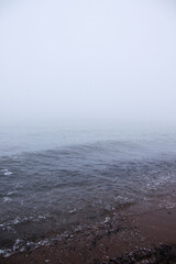 calm  beach landscape with fog