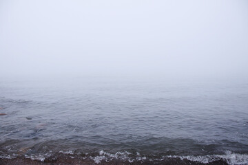calm  beach landscape with fog