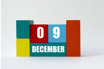 Day of month. Cube Calendar on multi-colored cubes on white background
