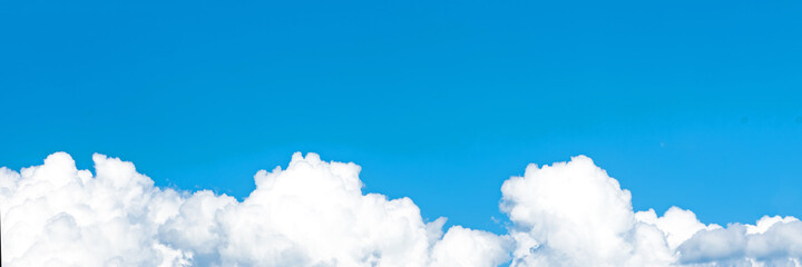 Naklejka na ściany i meble A beautiful blue sky and white cumulus clouds