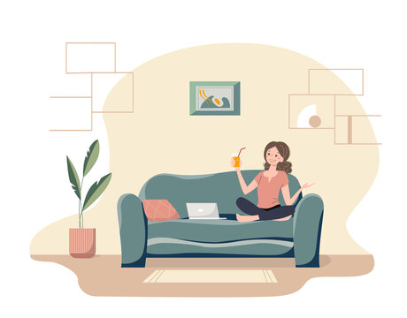 Happy cartoon girl with the glass of orange juice calls on a laptop. Nice young woman sitting on a sofa in her cozy living room. Modern home interior.