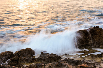 Blurred abstract natural background of sea water with waves and foam. Motion blur. Nature. 