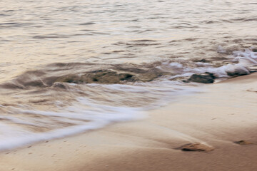 Blurred abstract natural background of sea water with waves and foam. Motion blur. Nature. 