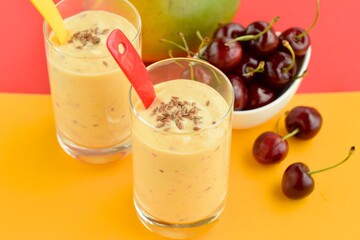 Refreshing drink mango cherry smoothie with flax seeds