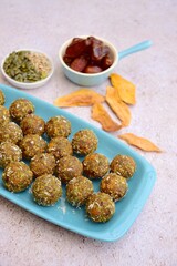 Mango date energy balls with pumpkin seeds and sunflower seeds