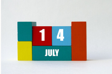 Day of month. Cube Calendar on multi-colored cubes on white background