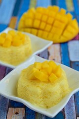 Mango pudding with cubed fresh mango on top