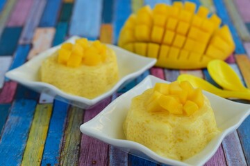 Mango pudding with cubed fresh mango on top