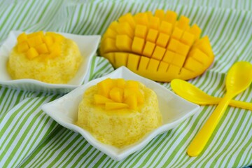 Mango pudding with cubed fresh mango on top