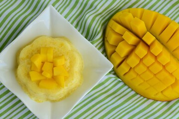 Mango pudding with cubed fresh mango on top