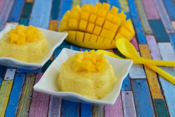 Mango pudding with cubed fresh mango on top