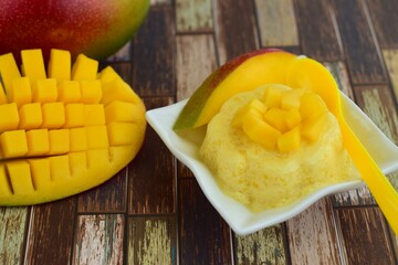 Mango pudding with cubed fresh mango on top