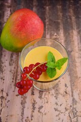 Mango red currant smoothie with mint leaf