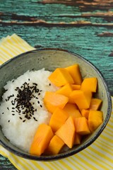 Mango sticky rice with black sesame seeds, Thai dessert