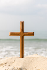 Wooden cross on the beach of the  Sea background. Easter concept. Concept  cross religion symbol in...