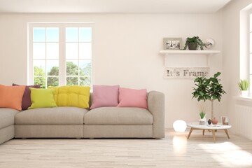 White living room with sofa and summer landscape in window. Scandinavian interior design. 3D illustration
