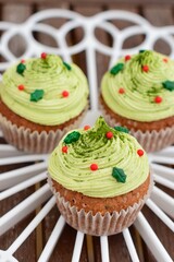 Christmas cupcake. Muffin with matcha green tea frosting 