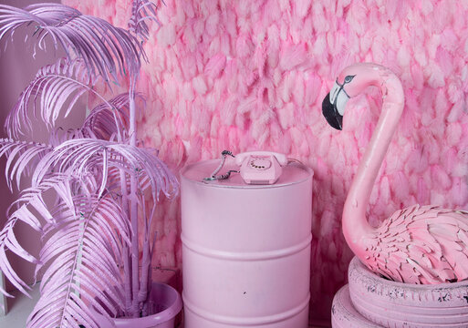 Pink children's room with flamingos. Wired Old Pink Phone with Dial Phone with Handset on Wire