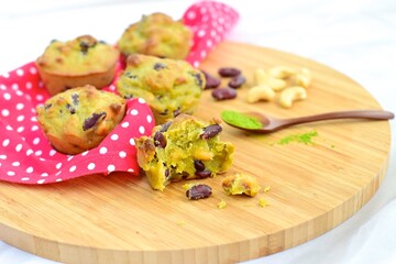 Matcha cashew kidney bean muffins on wooden board