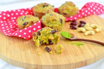 Matcha cashew kidney bean muffins on wooden board
