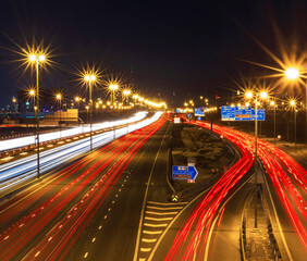 Fototapeta na wymiar Dubai, UAE - 02.22.2021 Shot of a night road with light trails. Outdoors