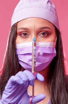 Woman with mask and vaccine