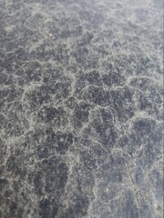 The old cement floor has intricate patterns but perfectly fine details