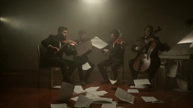 the string quartet plays classical music,notes fall from the air