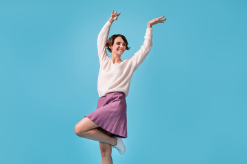 Obraz na płótnie Canvas Photo of young cheerful girl happy positive smile excited crazy have fun look empty space isolated over blue color background