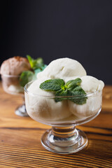 Ice-cream scoops variety in glass sundae bowls, refreshing dessert for summertime. Tasty homemade food, culinary concept